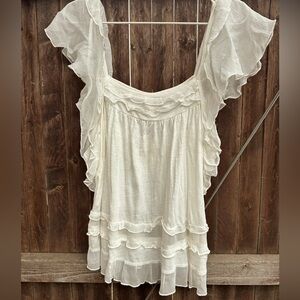 New with tags super cute cowgirl ruffle tank from Anthropologie,size medium.